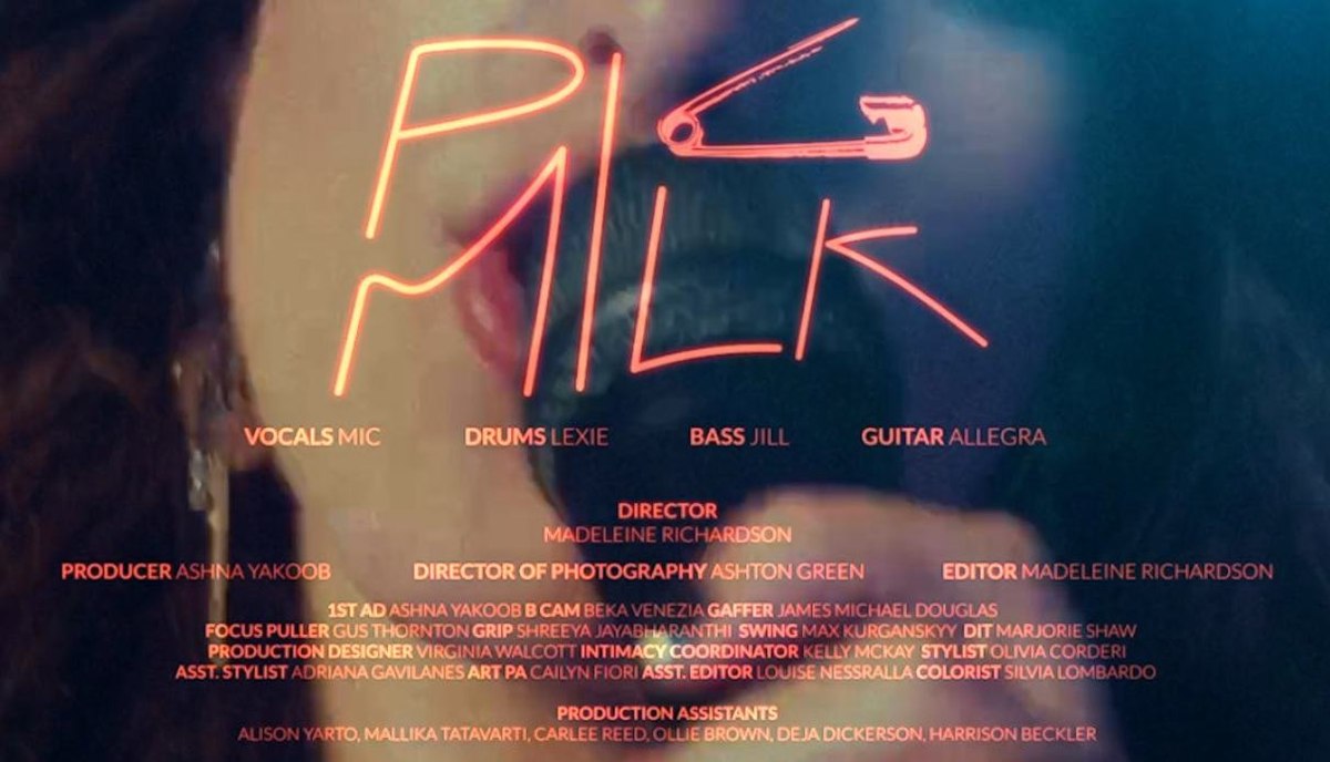 Neon-lettered title card reading Pig Milk, from the music video Ashna produced.