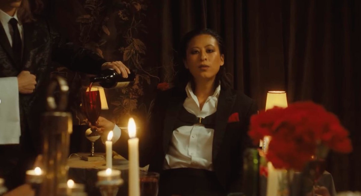 Candlelit dinner scene from the music video for Rego.